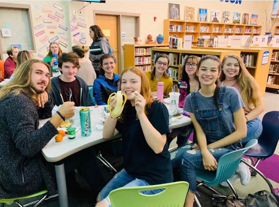 A+group+of+seniors+sit+in+the+media+center+and+enjoy+their+exclusive+senior+food.+The+first+senior+breakfast+was+held+Friday+September+20th+to+great+fanfare.+Image+courtesy+the+WHS+Senior+Instagram+page.