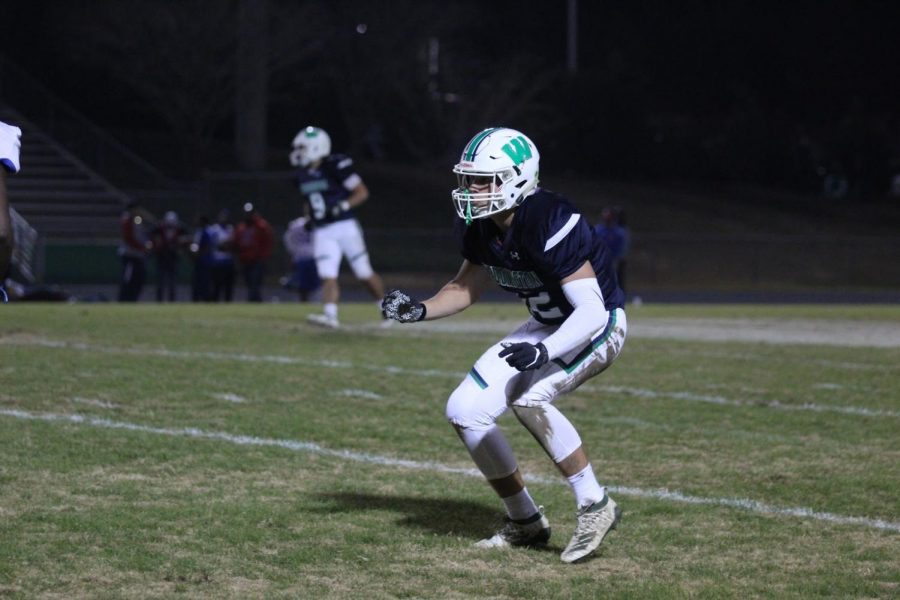 Senior Dusty Mercer stands ready while on offense against Parkland during the second round of the playoffs. His efforts along with the rest of the offensive line are what enabled Weddington to have such a stellar season. 