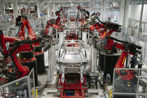 Robots working in a Tesla factory. Credit: Mason Trinca | The Washington Post | Getty Images