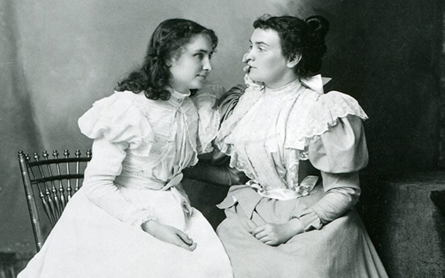 Deaf and blind student Helen Keller (left) listens to her teacher, Anne Sullivan, 1897. (Photo by PhotoQuest/Getty Images)