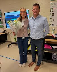 Ms. Aycock and Dr. Kraftson celebrate a victory.